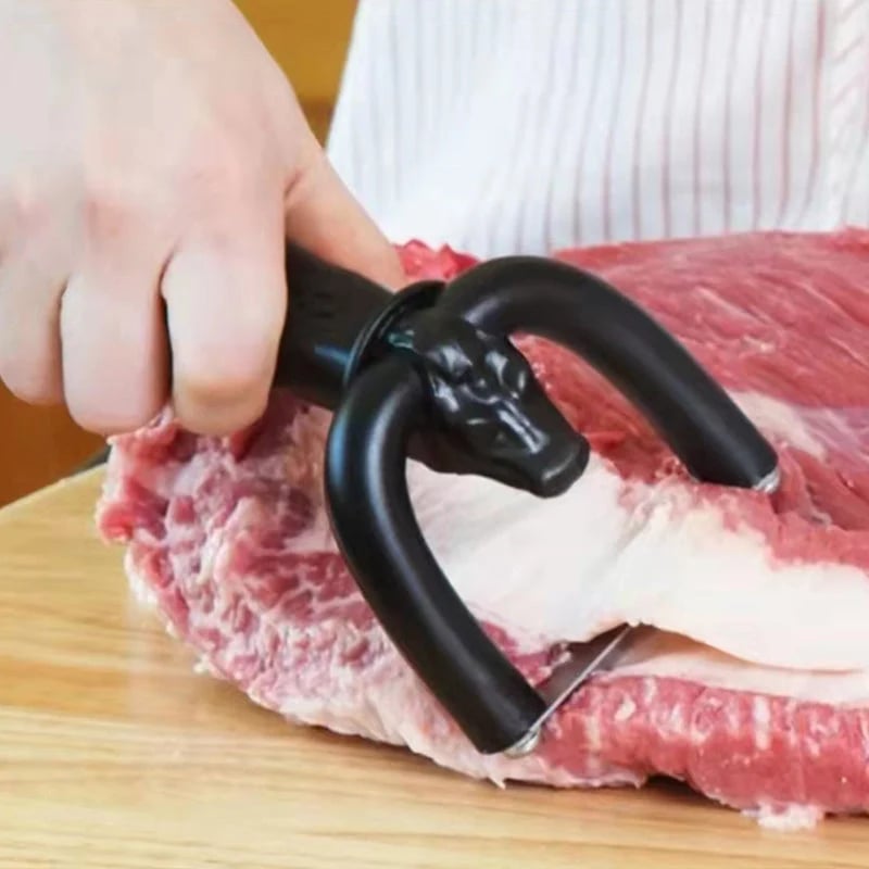 Handheld fat trimmer gliding through a layer of beef fat