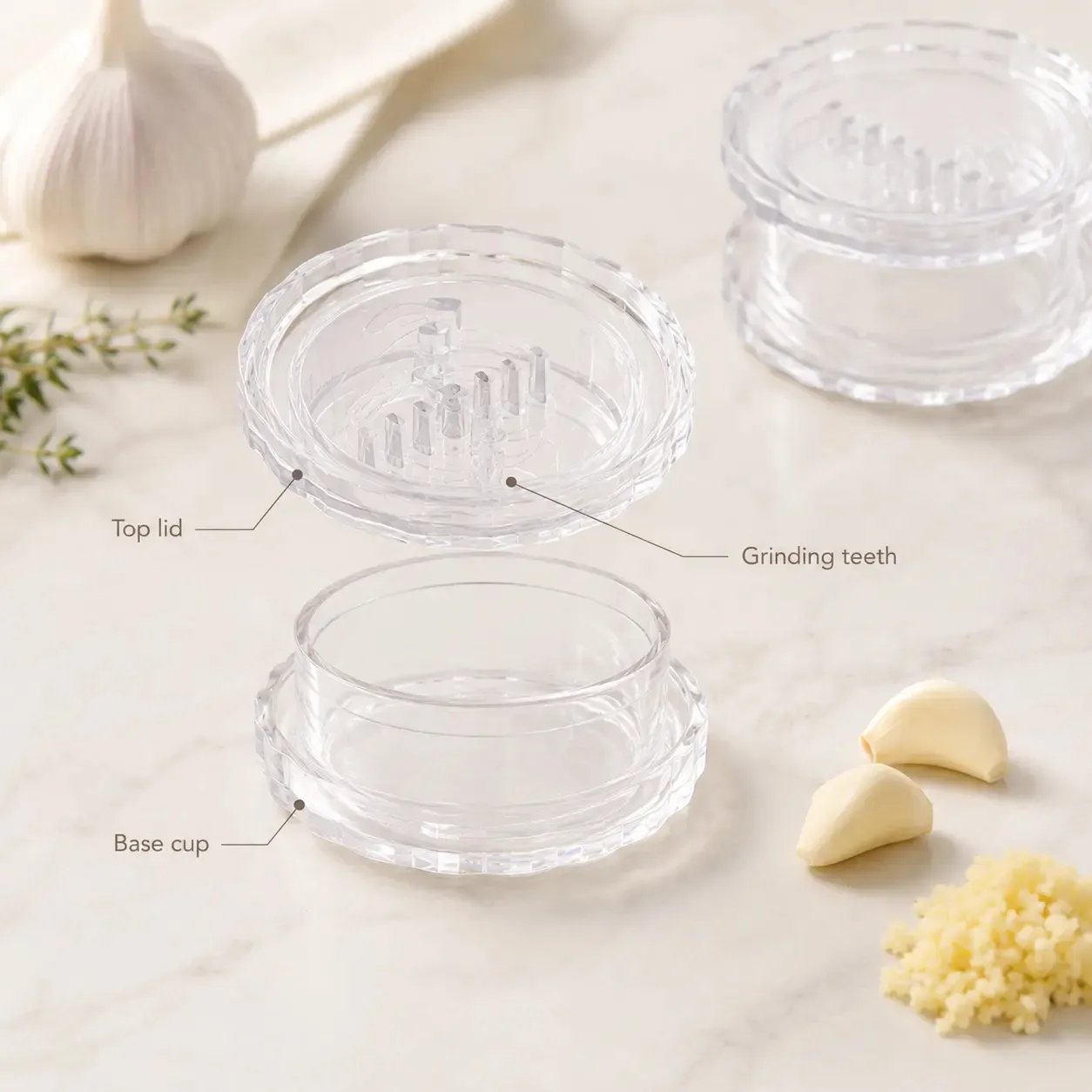 Garlic twister product breakdown showing top lid, grinding teeth, and base cup