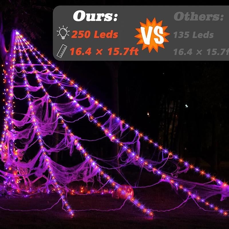 Purple and orange glowing Halloween spider web lights at night
