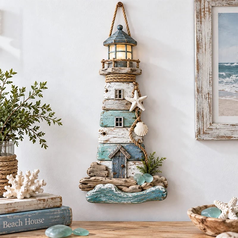 Coastal driftwood-inspired lighthouse wall decor with rope shells and sea glass accents